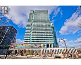 A tall building with a blue sky in the background.