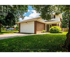 A house with a garage is for sale.