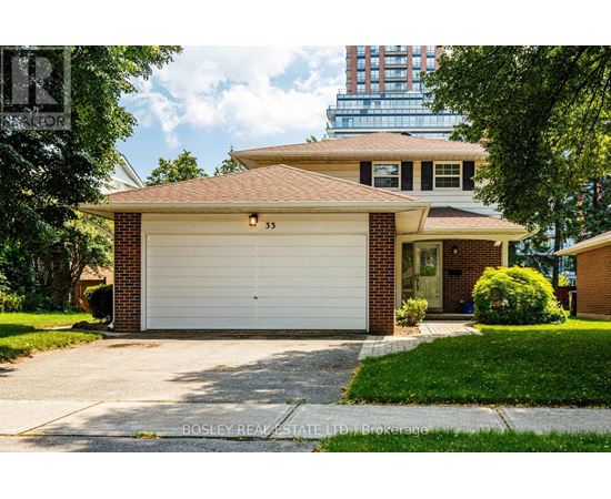 A two-car garage with a brick facade and a white door.