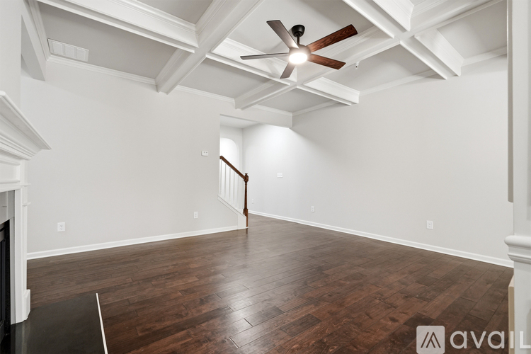 A spacious kitchen with dark wood cabinets and a center island.