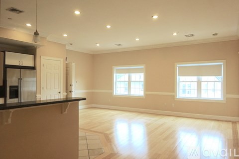 A spacious kitchen with a bar counter and a large island.