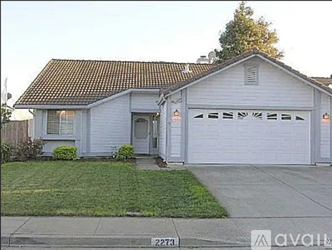 A two-car garage is attached to a house.