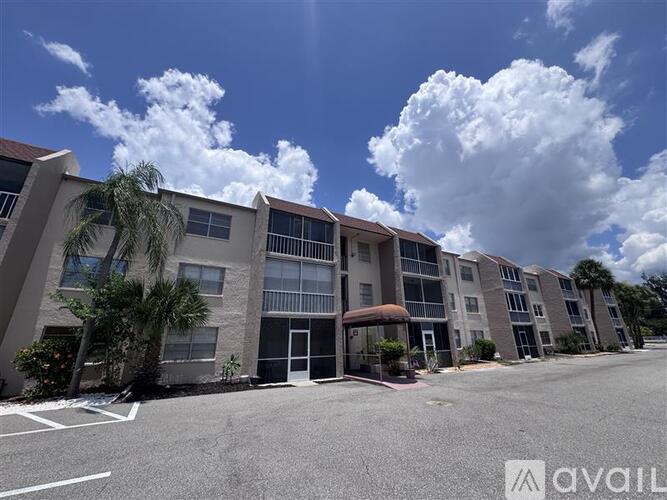 A row of modern apartment buildings with a cloudy sky above.