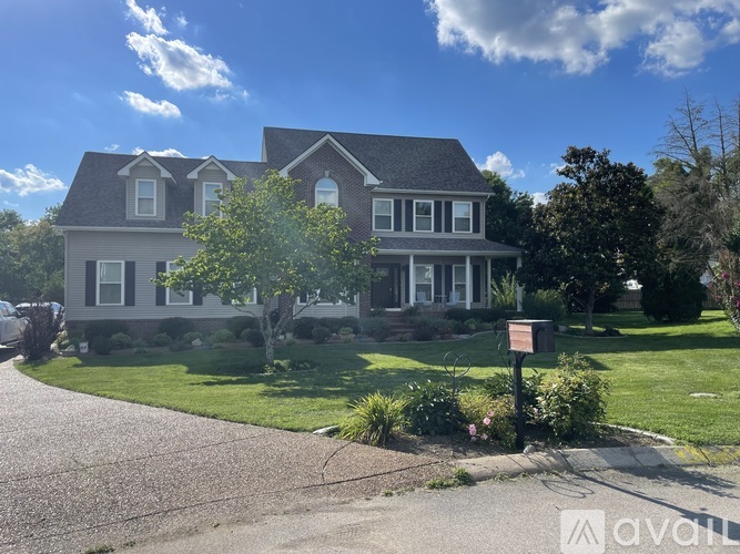 A house with a sign in front of it.