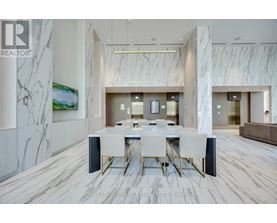 A dining room with a marble floor and a white table with chairs.