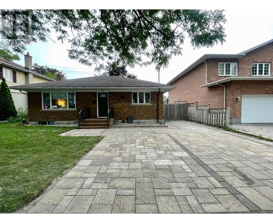 A house with a driveway in front of it.