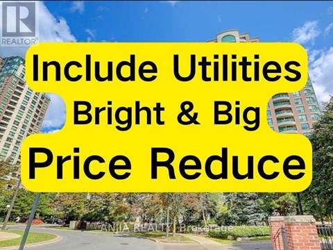 A sign with the text "Include Utilities Bright & Big Price Reduce" is displayed in front of a building.