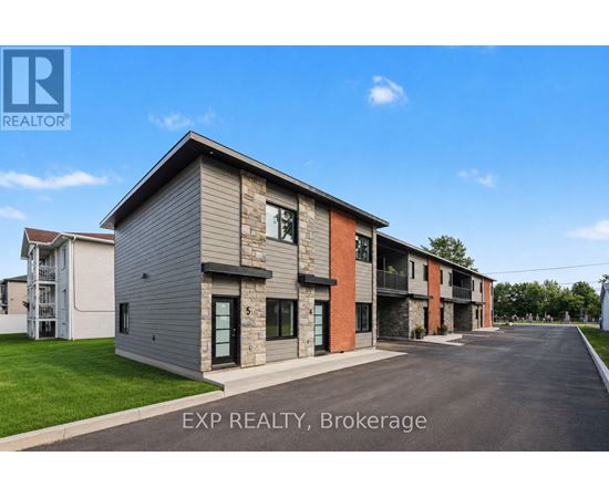 A row of houses with EXP REALTY, Brokerage written on the bottom.