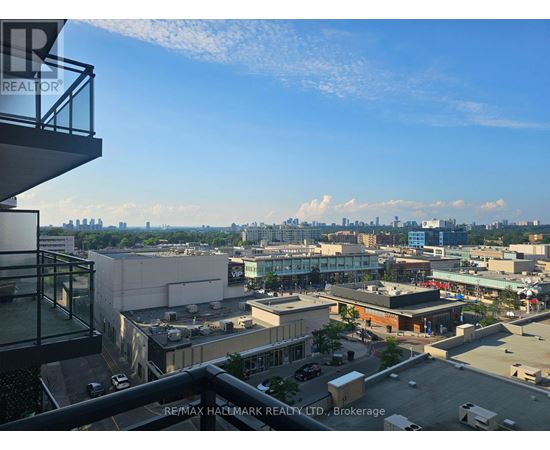 A view from a high-rise building looking out over a cityscape.