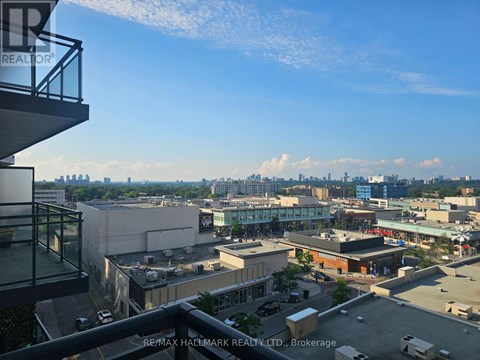 A view from a high-rise building looking out over a cityscape.
