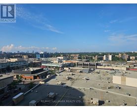 A view of a cityscape from a high vantage point with a clear blue sky.