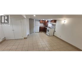 A kitchen area with a white refrigerator and a white oven.