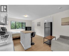 A realtor logo is on the top left corner of the image.