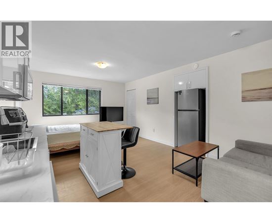 A realtor logo is on the top left corner of the image.