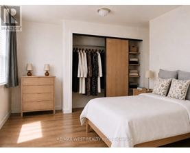 A bedroom with a large bed, a dresser, and a wardrobe.
