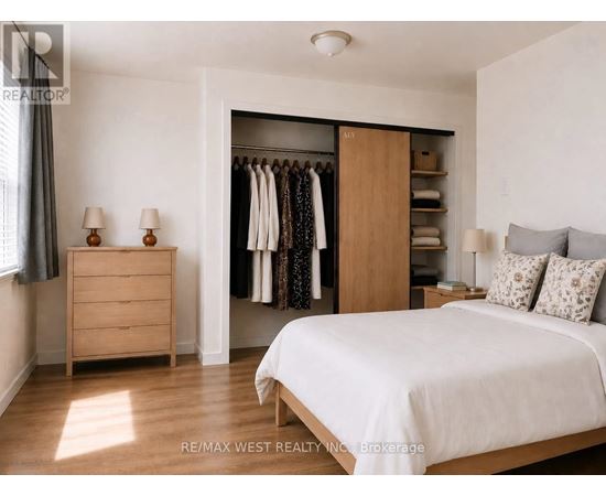 A bedroom with a large bed, a dresser, and a wardrobe.