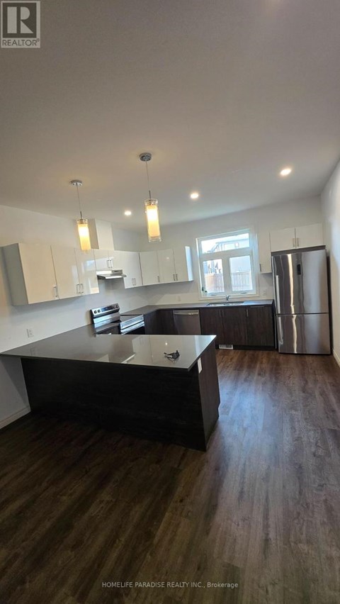 A kitchen with a wooden floor and a counter.
