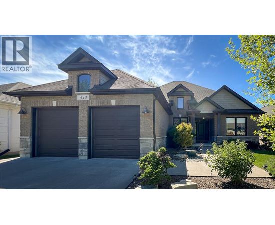 A house with a garage door numbered 433 is for sale.