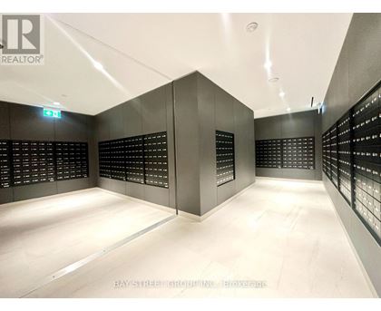 A brokerage office with a white floor and black walls.
