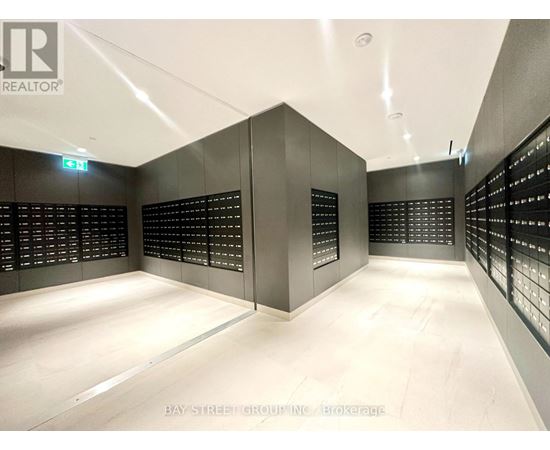 A brokerage office with a white floor and black walls.