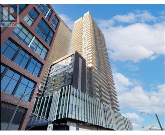 A tall building with a sign that reads "Global Bricks Executive Homes".