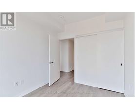 A white room with a door and a window.