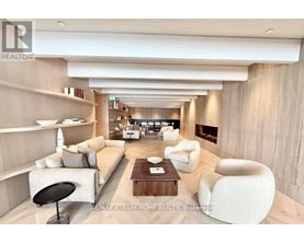 A modern living room with a fireplace and comfortable seating.