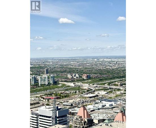 A cityscape with a clear sky and buildings of various heights.