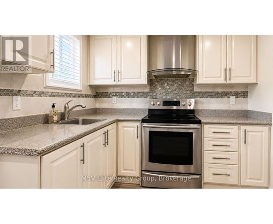 A kitchen with a stove top oven and a sink.
