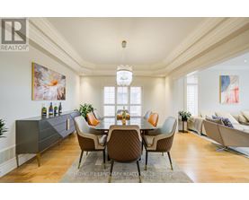 A dining room with a table set for six.