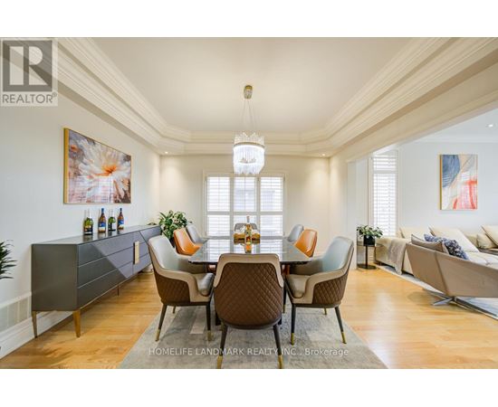 A dining room with a table set for six.