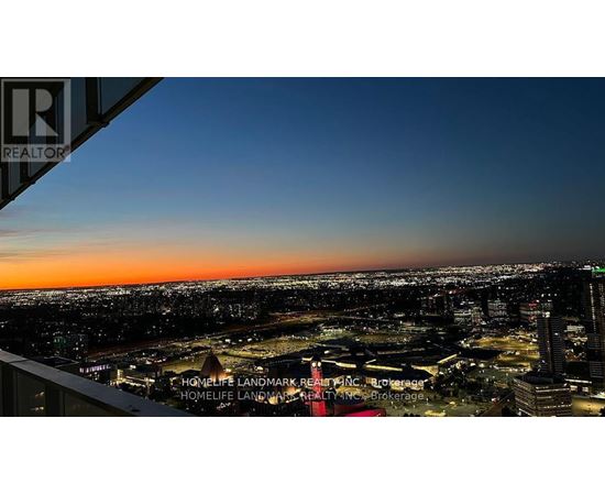 A cityscape at dusk with a sign that reads REALTOR.