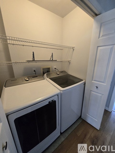 A small kitchen with a white oven and sink.