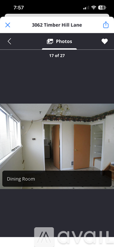 A dining room with a table and chairs is shown.