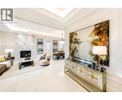 A living room with a fireplace and a painting on the wall.