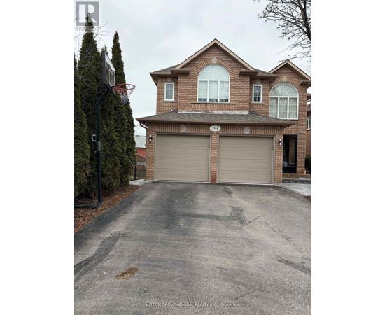 A house with a driveway in front of it.