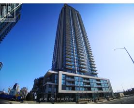 A tall building with the words "Real One Realty Inc." on the front.