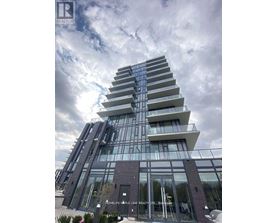 A modern building with a glass facade and a sign that reads "HOMELIFE APPLE LEAF REALTY LTD.".