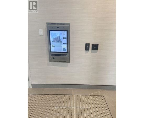 A realtor office has a touch screen display for prospective customers to look at properties.