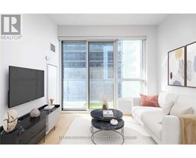 A living room with a flat screen TV, a black coffee table, a white couch, and a large window with a view of a building outside.