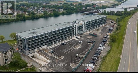 A large building with a parking lot in front of it.