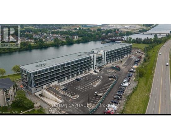 A large building with a parking lot in front of it.