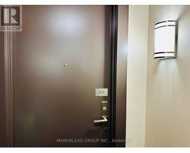A door with a handle and a number 610 on it.