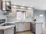 A modern kitchen with a sink and a window.