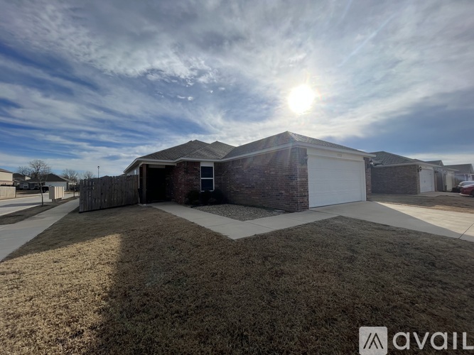 A house with a garage is available for sale.