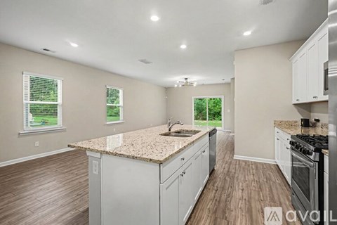 A bathroom with a white sink and a mirror.