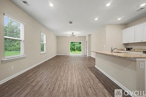 A white wall with a metal rod on top.