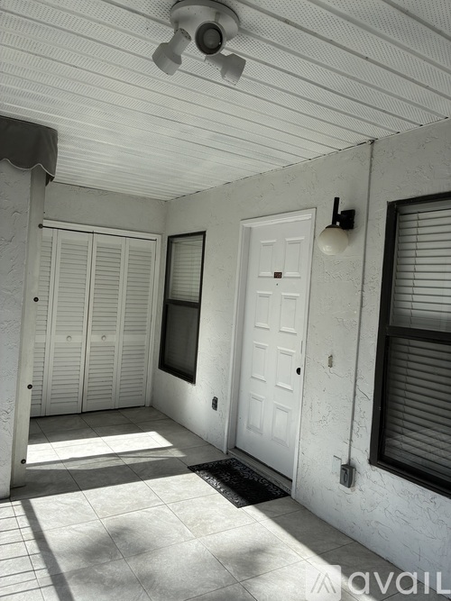 A white door is on the right side of the image.