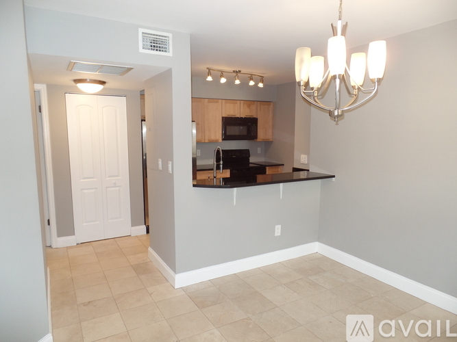 A kitchen area with a countertop and cabinets.