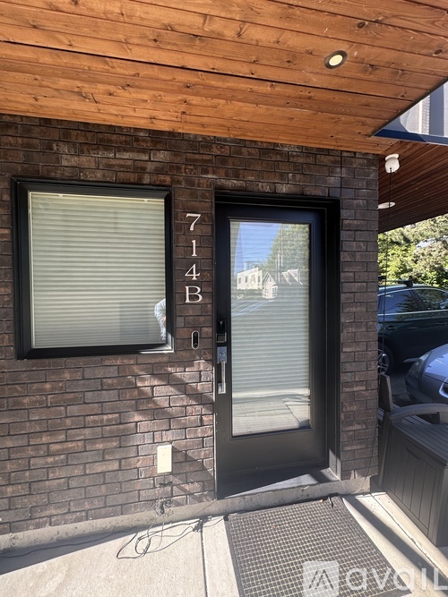 A black door with the number 714B on it.